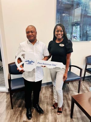 man-and-woman-holding-a-key