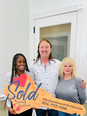 three-person-holding-a-key